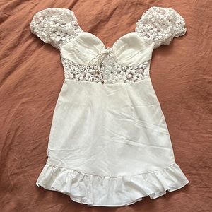 A cute white mini-dress perfect for a bridal shower or bachelorette trip!